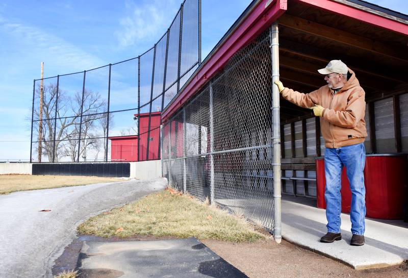 Ed Logue, 69, of Newton points towards the unfinished backstop of Eversman Field in Woodland Park. Logue and other Newton residents have concerns about the future of Woodland Park after the school district decided to build a more than $3 million baseball field across the street from H.A. Lynn Stadium.