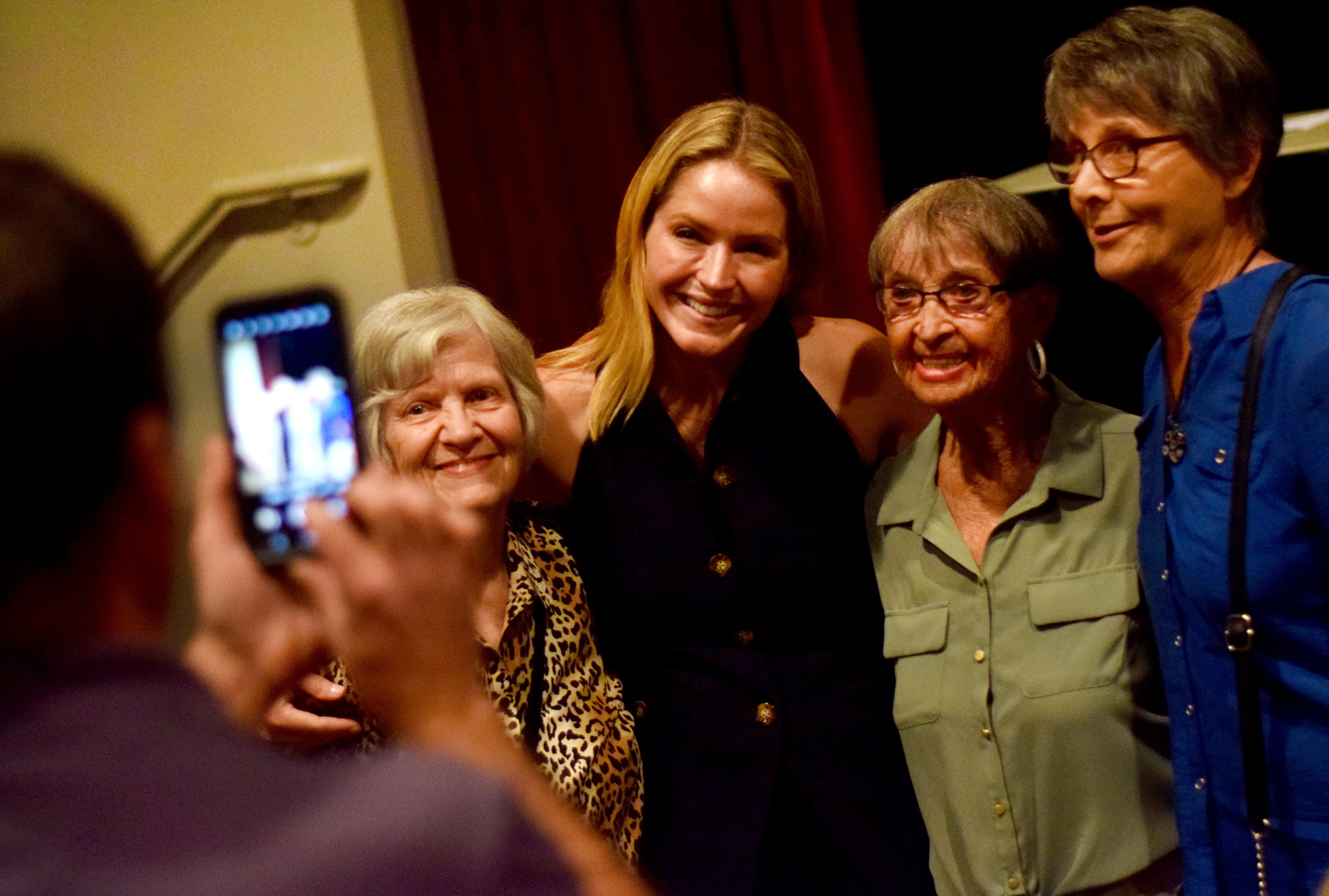 Sara Haines, a TV host and Newton native, poses for pictues with residents and old friends after her speech during the United Way of Jasper County’s “Voices of Inspiration” series on Aug. 6 inside the conference center of the DMACC Newton Campus.