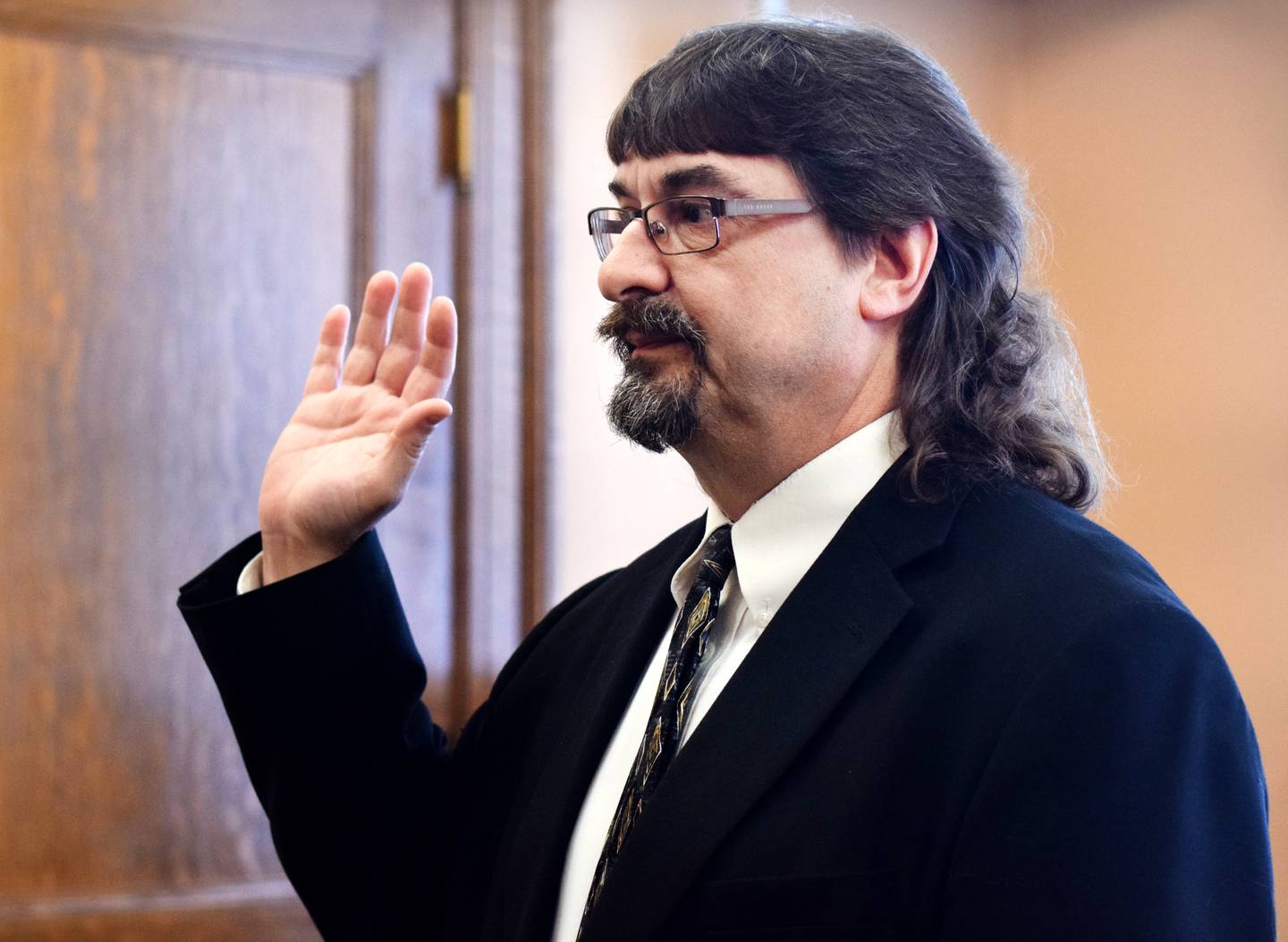 Jasper County Attorney Scott Nicholson is sworn in to office on Dec. 27 by Iowa District Court Judge Mike Jacobsen.