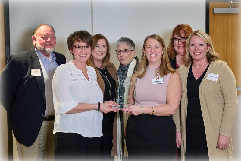 The Newton RAGBRAI Committee accepts the Key Award from Greater Newton Area Chamber of Commerce Executive Director Amanda Price during the 125th Annual Meeting and Awards Dinner on Jan. 18 at the DMACC Newton Campus Conference Center. Photo by John Lee Photography.