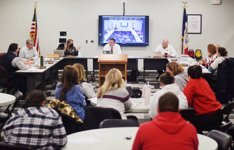 The Newton Community School District Board of Education discusses the master planning options while an audience of parents and faculty watch on Dec. 4 at the E.J.H. Beard Administration Center.