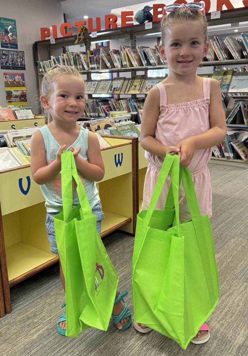 Alyza Parsons, 3, and Emma Parsons, 5, have completed Newton Public Library's 1,000 Books Before Kindergarten program.