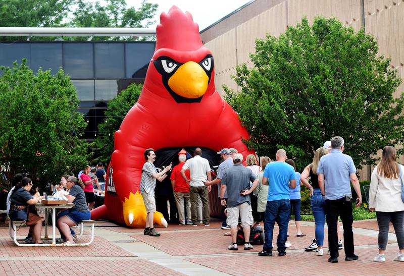 Newton High School graduates gather for drinks and camaraderie at the all-class reunion June 7 at Legacy Plaza. Newton Alumni Weekend brought back Cardinals for a weekend of partying and fellowship.