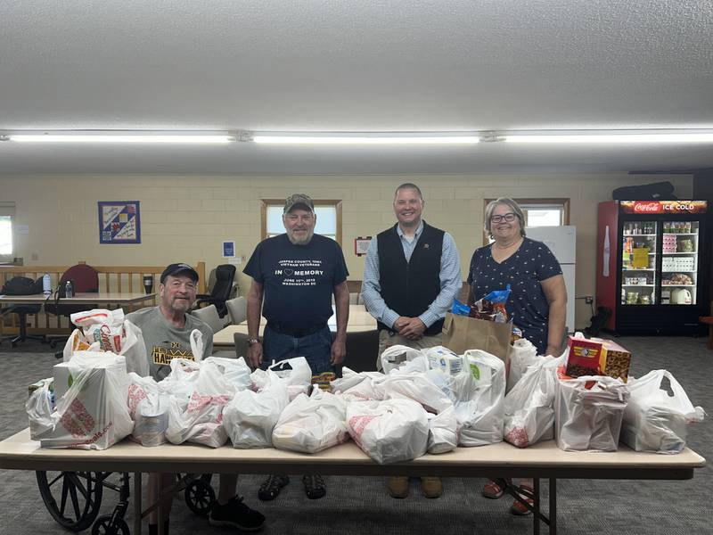 HyVee donates an overflowing table of food to the PCM Food Pantry in Monroe. The pantry is open from 9 a.m. to noon Mondays and Thursdays and 6 to 7 p.m. Mondays at the Monroe Presbyterian Church.