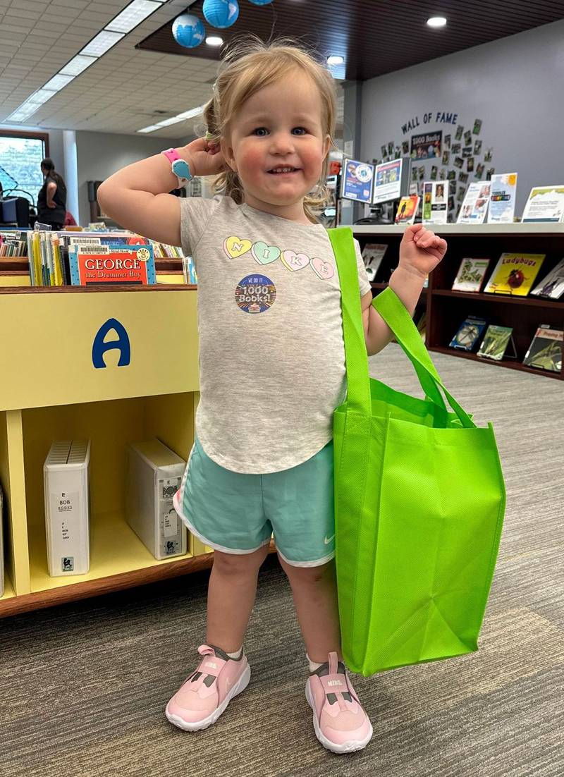 Marlee Calow, age 2, who just finished the 1,000 Books Before Kindergarten program at the Newton Public Library.