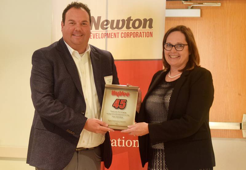 Stacey Johnson, vice president of government relations at Hy-Vee, is presented an award from Newton Development Corporation on Oct. 13 during the Salute to Business & Industry Luncheon inside the DMACC Conference Center. Hy-Vee was honored for its efforts in bringing back racing and entertainment to Iowa Speedway.