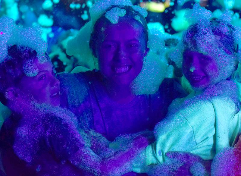 Kids enjoy the return of the Glow Foam Party – which featured two cannons this year – during Newton Fest on June 7 at Maytag Park.