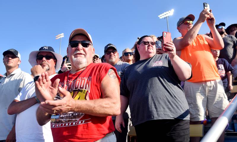 Race fans cheer on their drivers just before the NASCAR Cup Series Iowa Corn 350 race on June 16 at the Iowa Speedway in Newton.