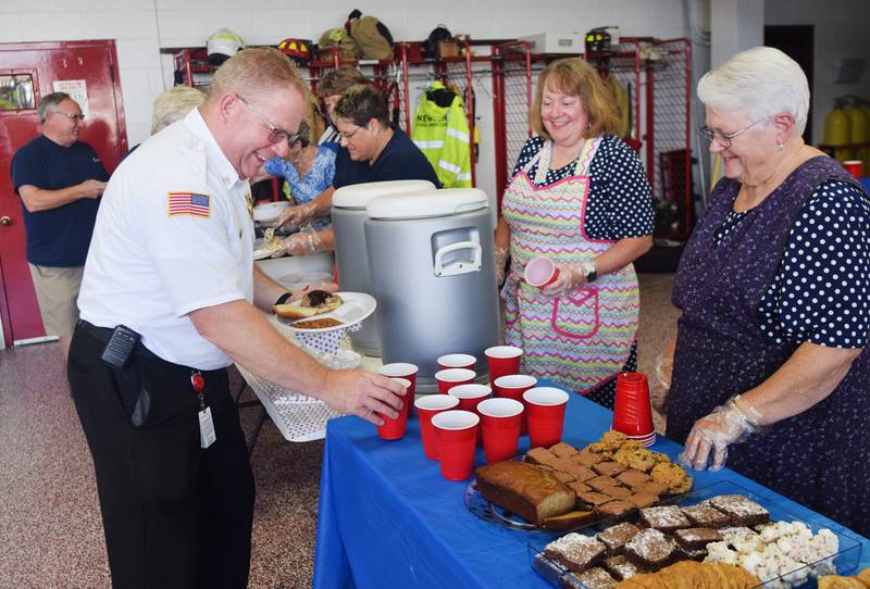 Newton Fire Chief Jarrod Wellik enjoys a meal provided by the Order of the Eastern Star on Aug. 28 at the local fire station. The fraternal organization wanted to show its support for firefighters and paramedics at Newton Fire Department by providing a free meal and a $100 check for the SAFE House Program.