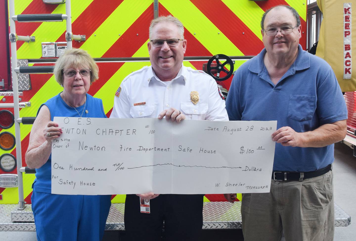 Sue Eldred, the Worthy Matron of the Newton chapter of the Order of the Eastern Star; Newton Fire Chief Jarrod Wellik; and Terry Osborne, the Worthy Patron of the Newton chapter of the Order of the Eastern Star pose for a picture. The fraternal organization wanted to show its support for firefighters and paramedics at Newton Fire Department by providing a free meal and a $100 check for the SAFE House Program. This donation is to assist all Jasper County fire departments in the use and promotion of the SAFE House to benefit the safety of all of the Jasper County children.