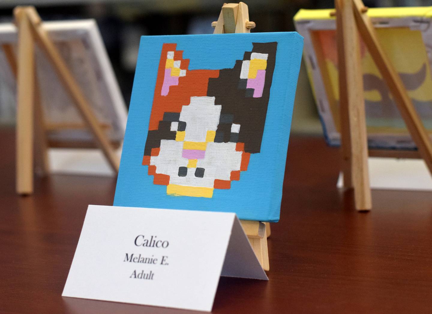 Library staff say artists ages 3 through 77 have submitted miniature artwork for the Newton Public Library's Tiny Art Show.
