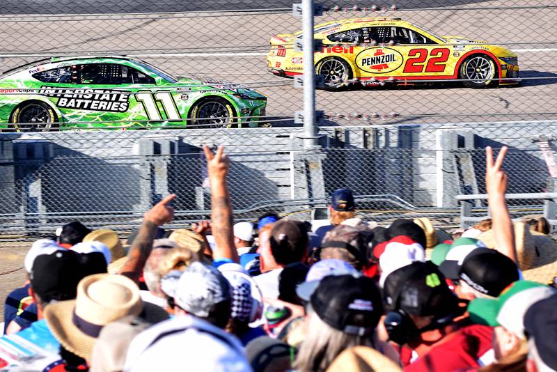 Race fans cheer on their drivers just before the NASCAR Cup Series Iowa Corn 350 race on June 16 at the Iowa Speedway in Newton.