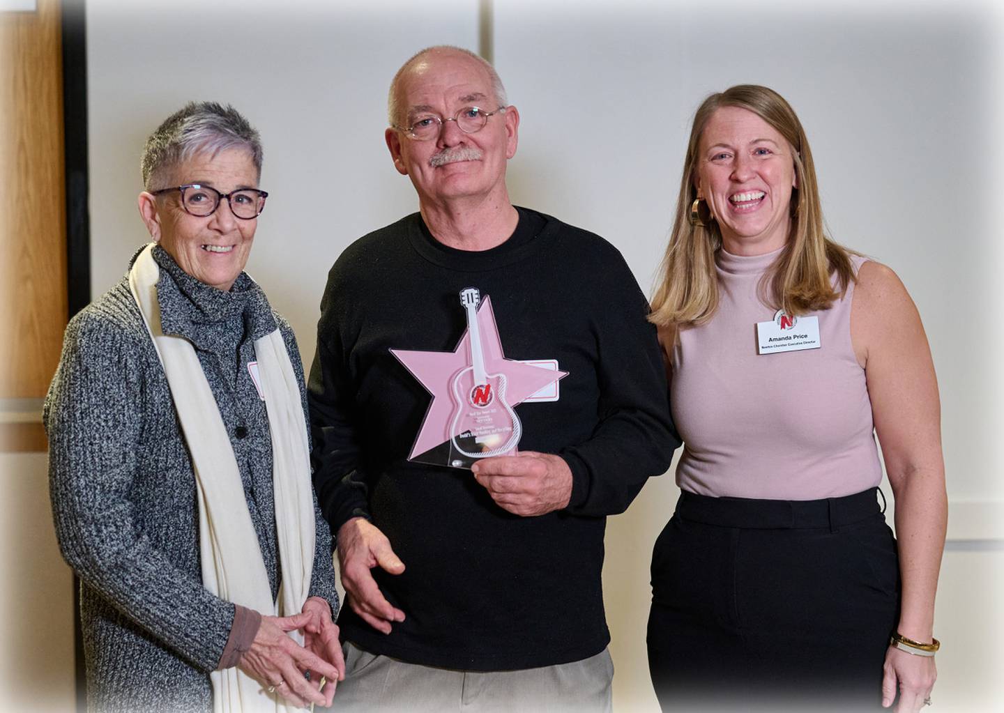 Liz and Dave Dodd of Dodd's Trash Hauling & Recyling accept the Community Rock Star Award for a small business from Greater Newton Area Chamber of Commerce Executive Director Amanda Price during the 125th Annual Meeting and Awards Dinner on Jan. 18 at the DMACC Newton Campus Conference Center. Photo by John Lee Photography.