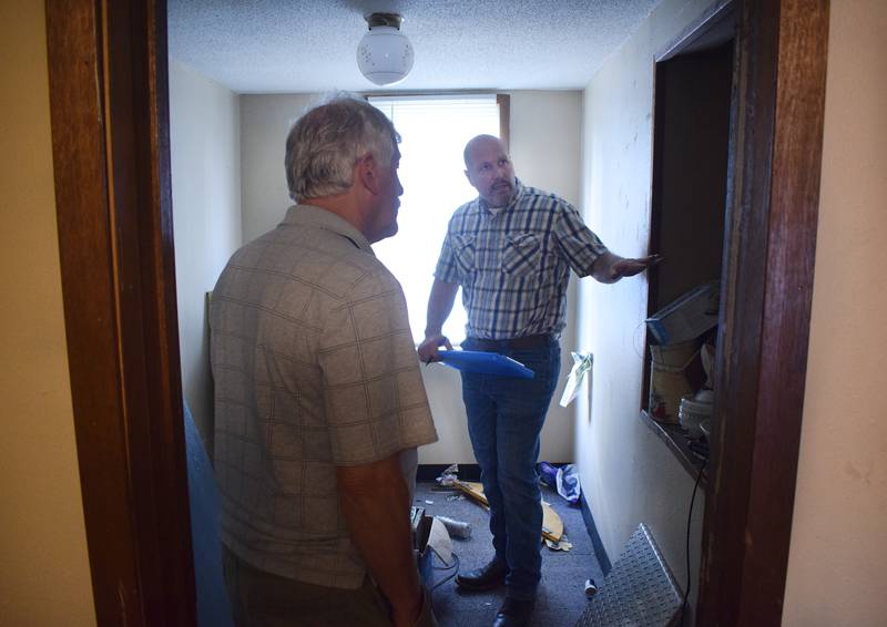 Jason VanAusdall, a contracted rental property inspector of Iowa Inspections, conducts a rental property assessment in 2019.