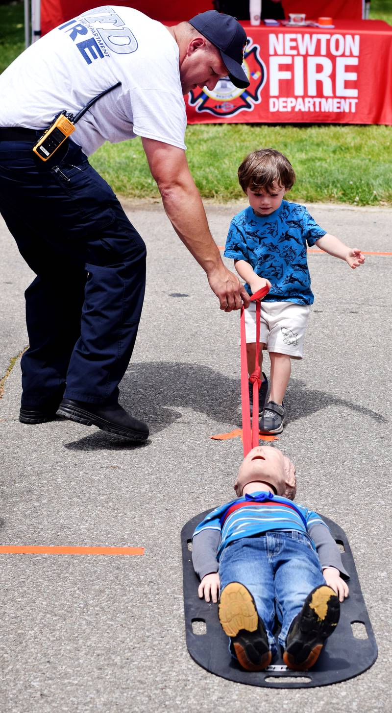 Kids participate in obstacle courses and take a try at the fire hose during Safety Fest on June 8 in Maytag Park. Safety Fest is regularly organized by the Newton Fire Department.
