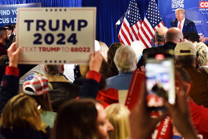 Former president Donald Trump speaks to audiences during a Jan. 6 commit-to-caucus rally in at the DMACC Newton Campus.