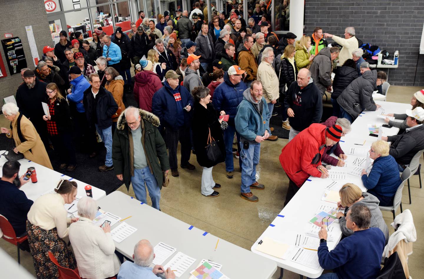 Newton residents gather during caucus night Jan. 15 at Berg Middle School. Despite frigid temperatures and overwhelming snowfall, residents showed up in droves to participate in the caucuses, which were overwhelmingly in support of former president Donald Trump in Jasper County and throughout the state.